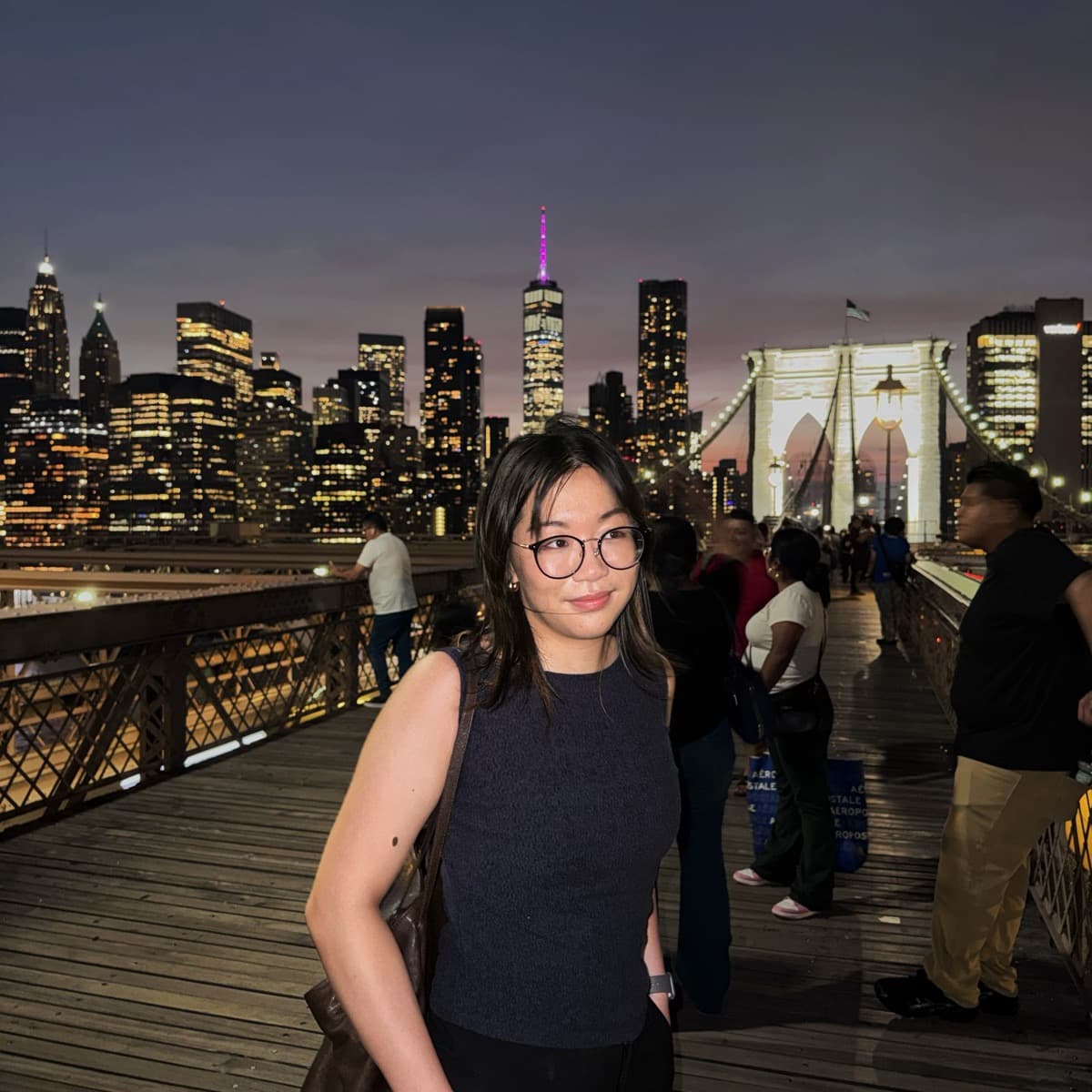 Jessie Li on the Brooklyn Bridge at dusk